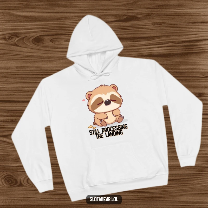 Funny hoodie featuring a dazed sloth bear looking bewildered after a soft tumble, offering warmth and humor.