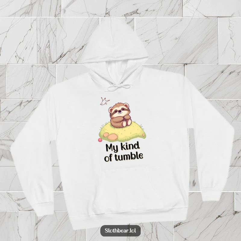 Funny kawaii sloth bear playfully rolling down a gentle, mossy hill, printed on a soft hoodie for cozy, humorous wear.