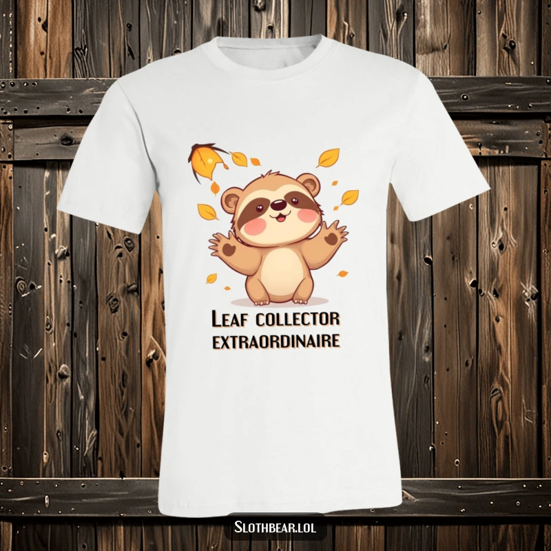 Funny sloth bear t-shirt depicting a character joyfully attempting to catch falling leaves, embodying autumn playtime fun.